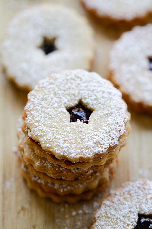 Easy homemade mini Linzer cookies made with raspberry jam and dusted with powdered sugar.