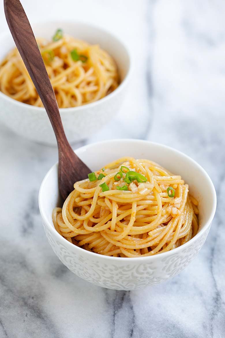 garlic sriracha noodles served in a bowl.