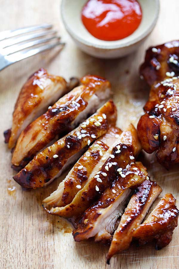 Easy and quick homemade Asian hoisin sriracha chicken coated with brown glaze.