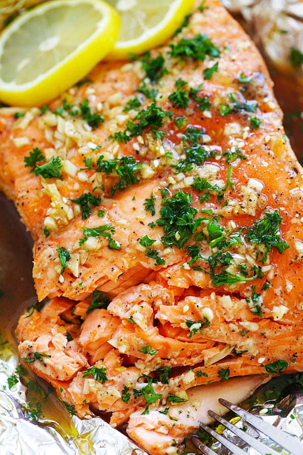 Easy and delicious oven roasted salmon with soy sauce and honey butterin aluminium foil, ready to serve.