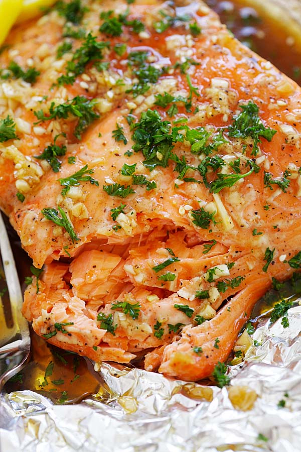 Close up flaky Soy Honey Butter Salmon in aluminium foil.