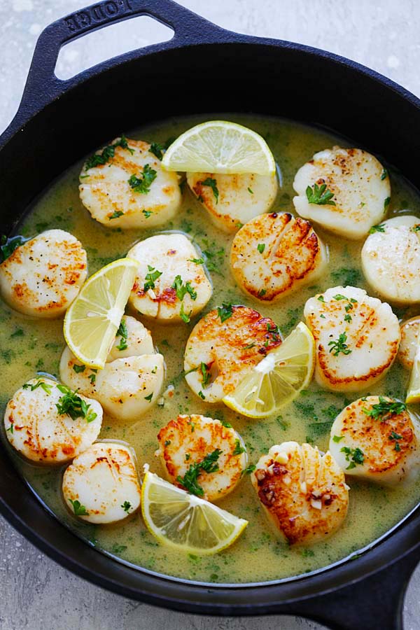 Easy and quick pan-seared scallops with buttery lemon sauce.