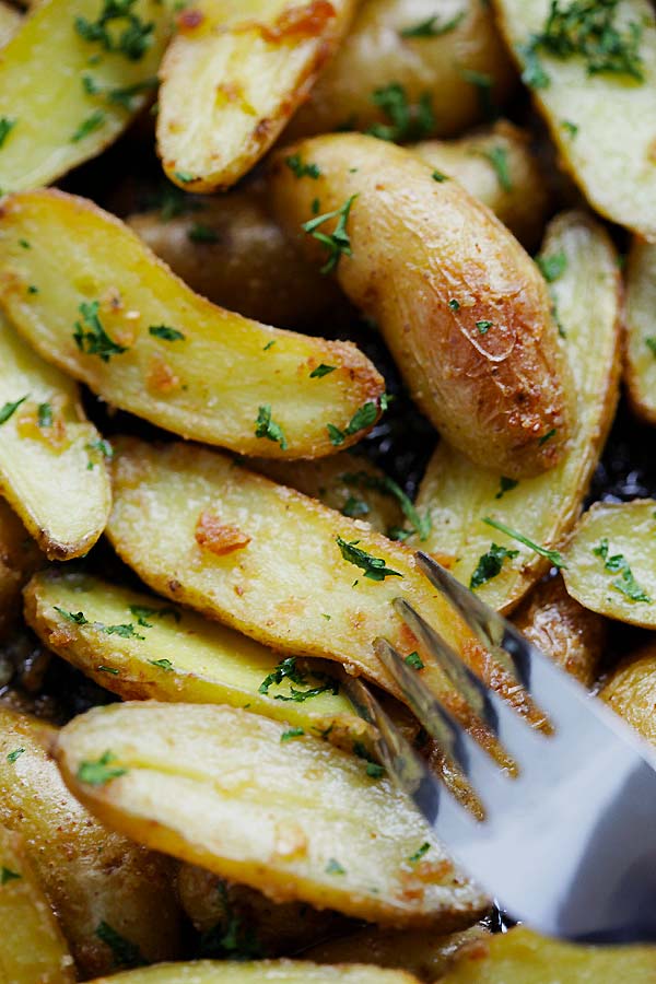 Pan roasted garlic fingerling potatoes in a skillet.