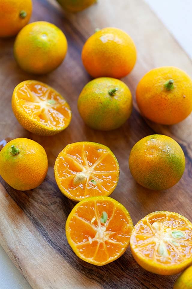 Calamansi lime on a chopping board.