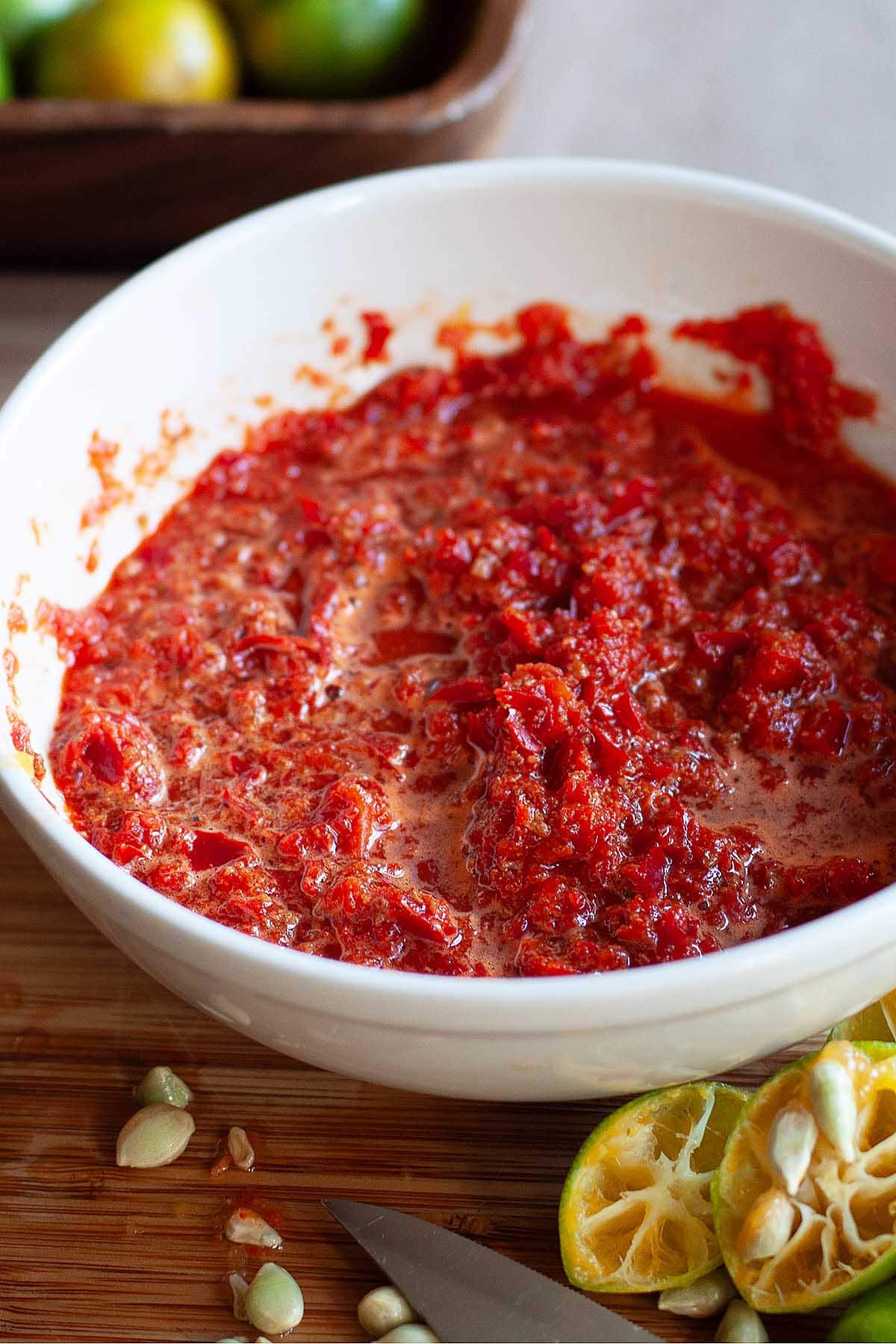 Malaysian sambal belacan recipe made with fresh red chilies, toasted belacan and calamansi lime juice. 