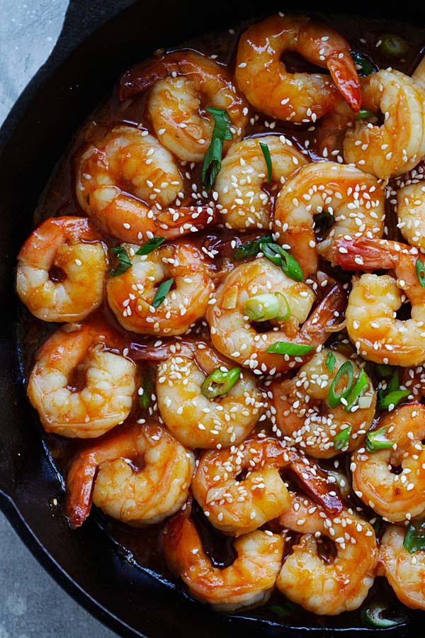 Sweet and sour shrimps garnished with sesame seeds.