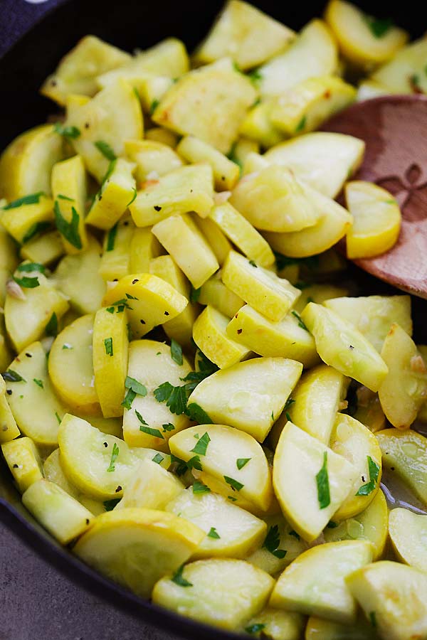 Close up homemade Sauteed Yellow Squash with garlic, butter and lemon.