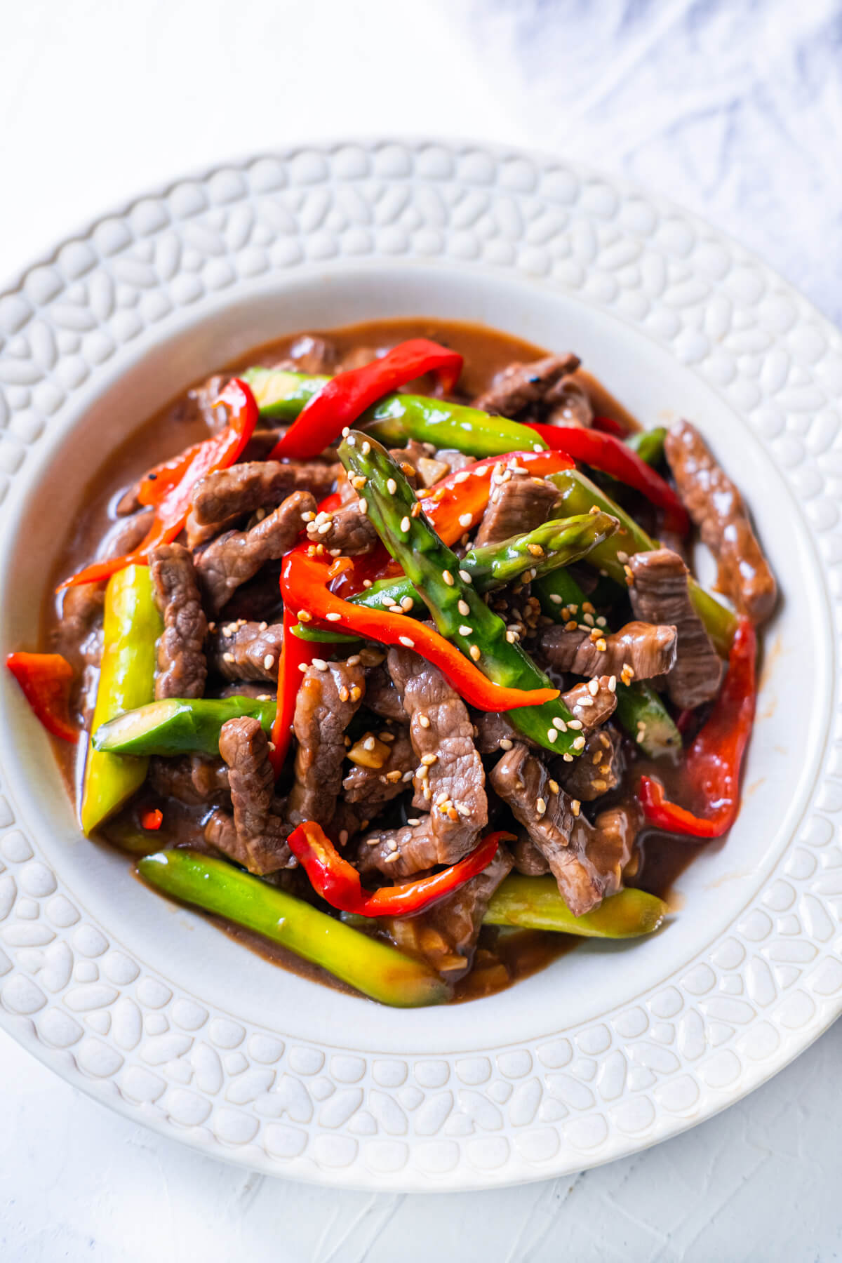 Beef asparagus recipe served on a plate.