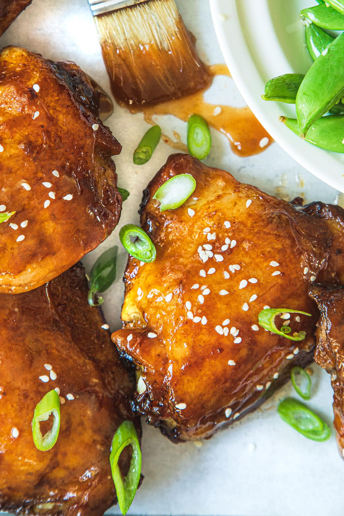 Moist, tender, and juicy chicken thighs marinated with honey, soy sauce, ginger, and garlic, and baked in the oven. 