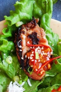 Korean BBQ Chicken served with lettuce and rice.