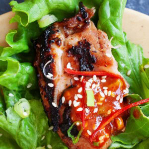 Korean BBQ Chicken served with lettuce and rice.