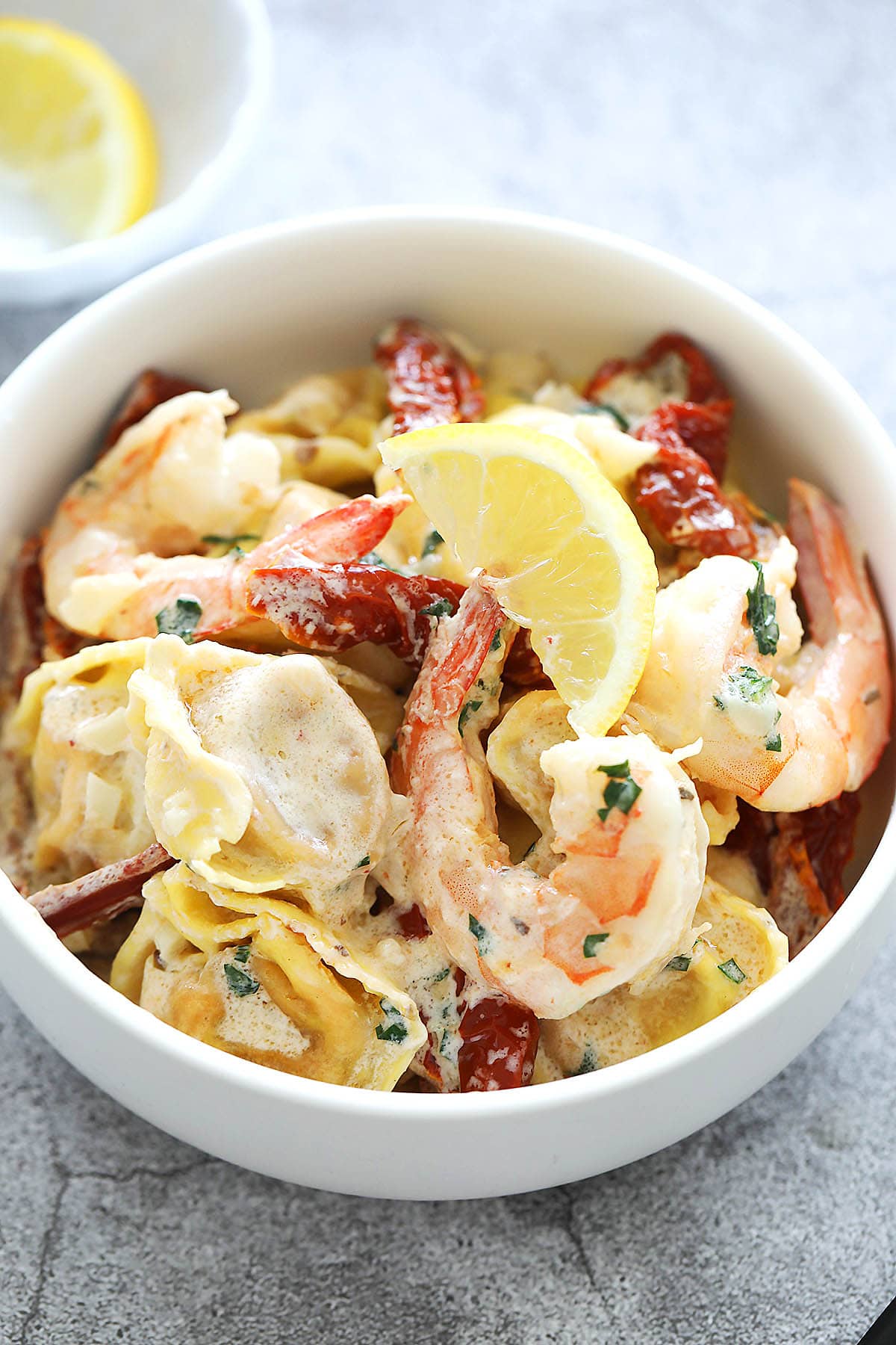 Quick and easy shrimp tortellini with creamy garlic sauce. 