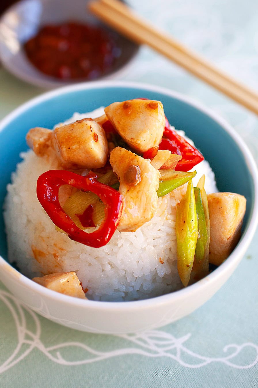 Spicy stir fry chicken served on a bowl of rice. 