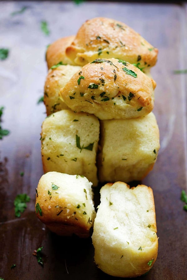 homemade pull apart garlic bread recipe on table.