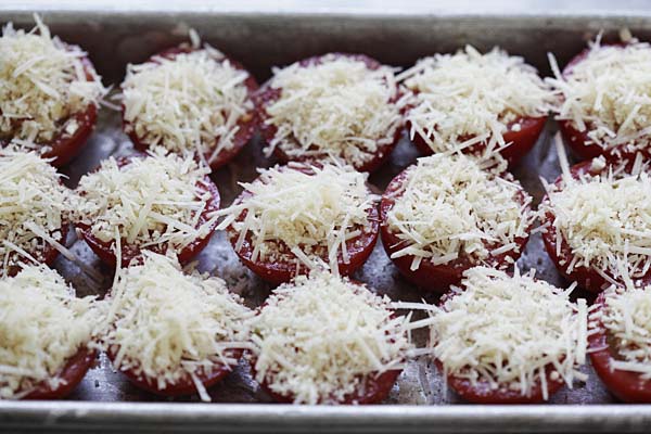 Add breadcrumbs and parmesan cheese on the tomatoes. 