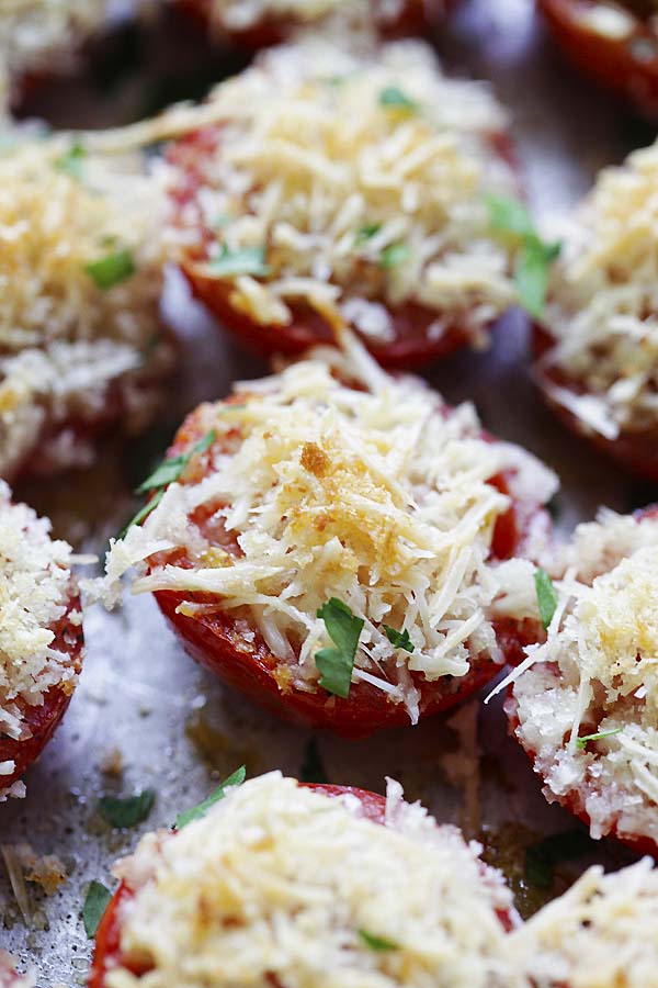 Baked tomatoes on a baking sheet.