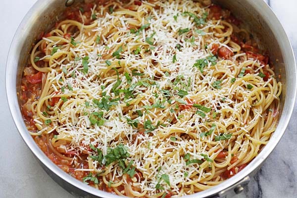 One-pan pasta topped with Parmesan cheese and chopped parsley is one of the easiest pasta recipes ever!