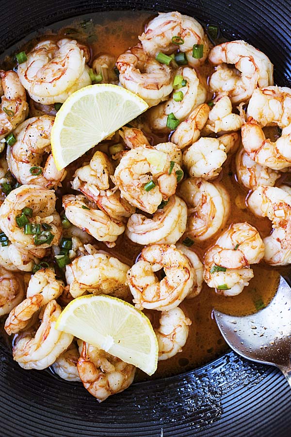 Asian garlic butter shrimp with sauce in a wok.