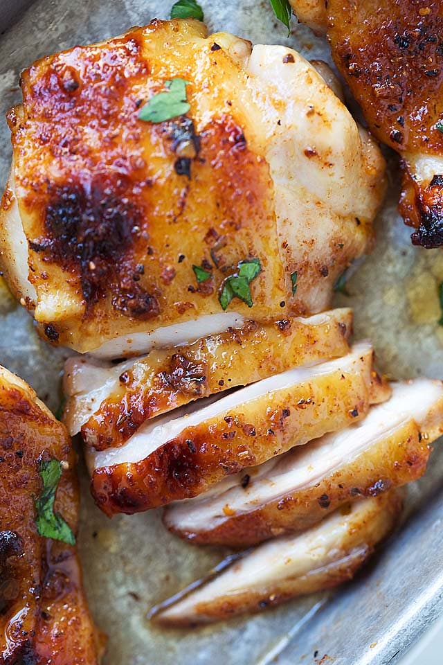 The best and juiciest baked chicken thighs marinated with Cajun spices and honey. 