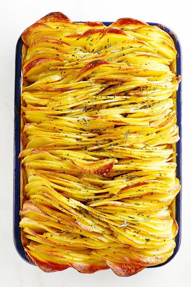 Crispy roasted leaf potatoes in a baking tray.