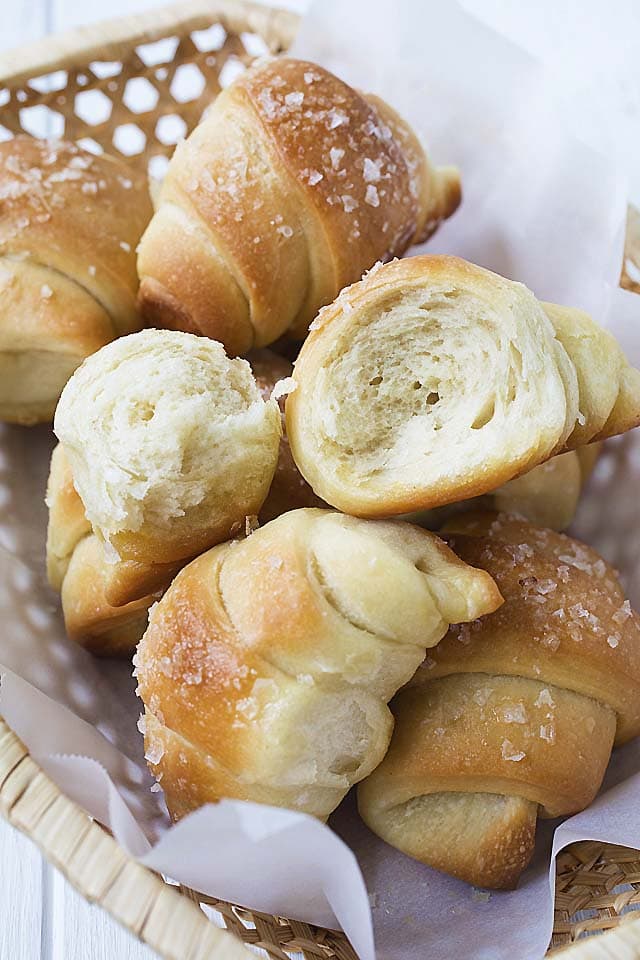 Soft and fluffy homemade sea salt butter rolls in half.