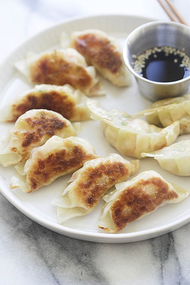 Serving potstickers with Chinese black vinegar dipping sauce.