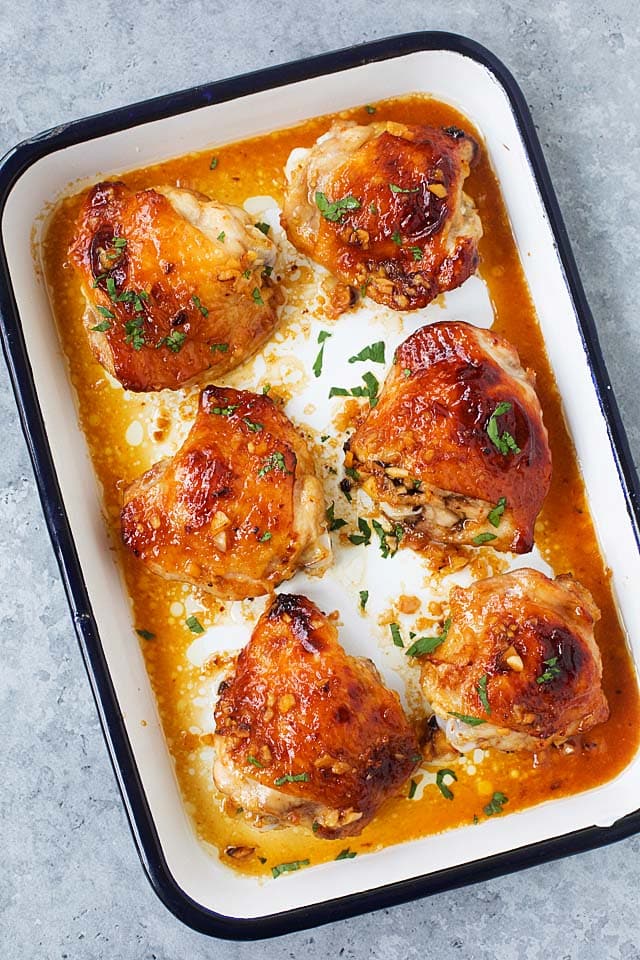 Top down picture of baked chicken thighs with honey garlic marinade.