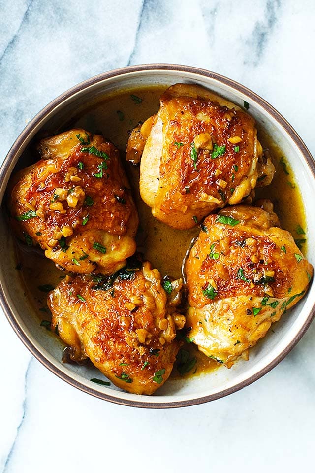 Brown sugar garlic chicken thighs in a serving ware.