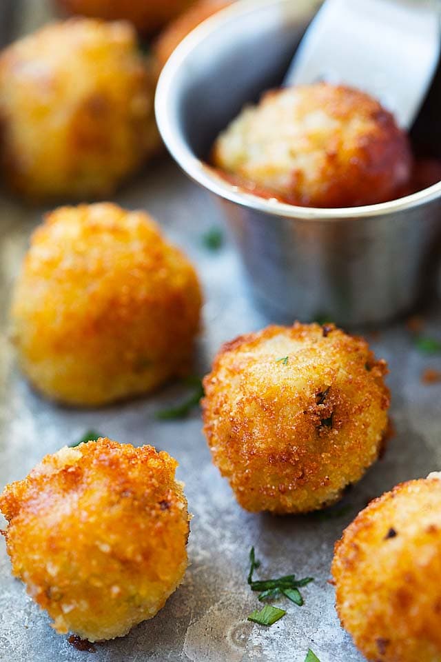 Fried mashed potato balls served with ketchup.