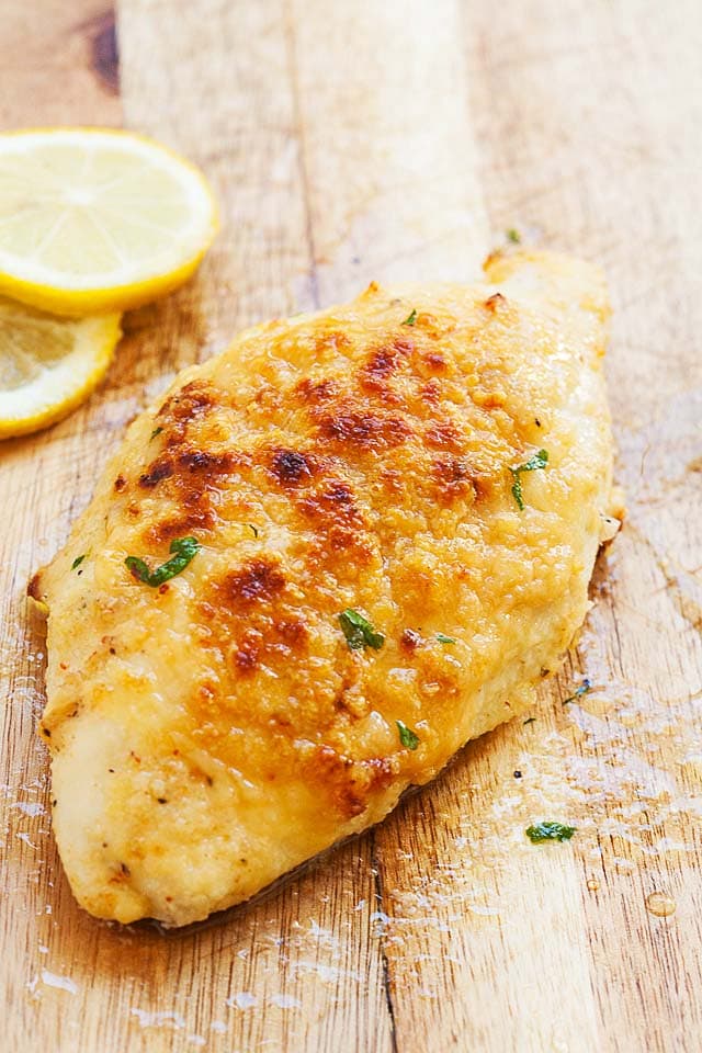 Easy oven baked chicken breast recipe served with a fork.