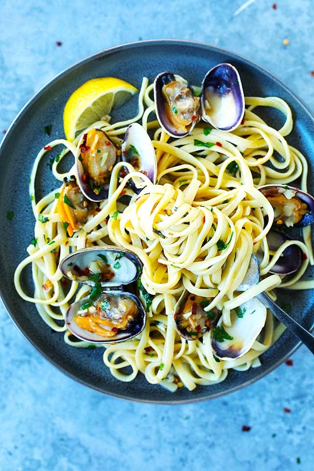 Clam linguine pasta served on a plate, with a fork.