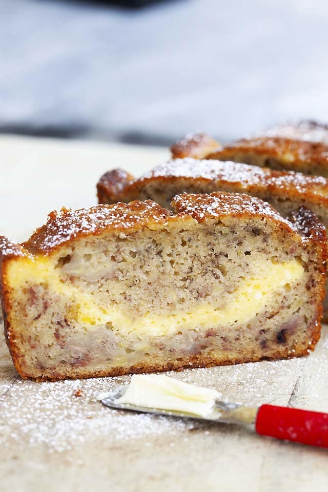 Close-up picture of a piece of cheesecake banana bread, or cream cheese banana bread.