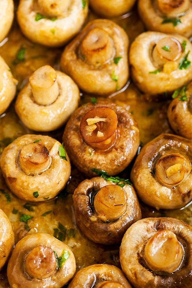 Macro shot of sauteed mushrooms.