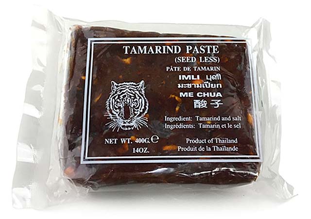 Pad Thai with tamarind is made with tamarind juice extracted from tamarind pulps. This is a picture of tamarind block in clear plastic packaging.