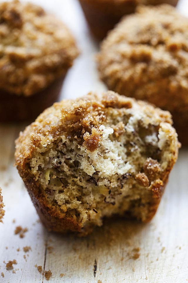 Inside of moist banana muffins with crunchy crumbs at the top of the muffins.