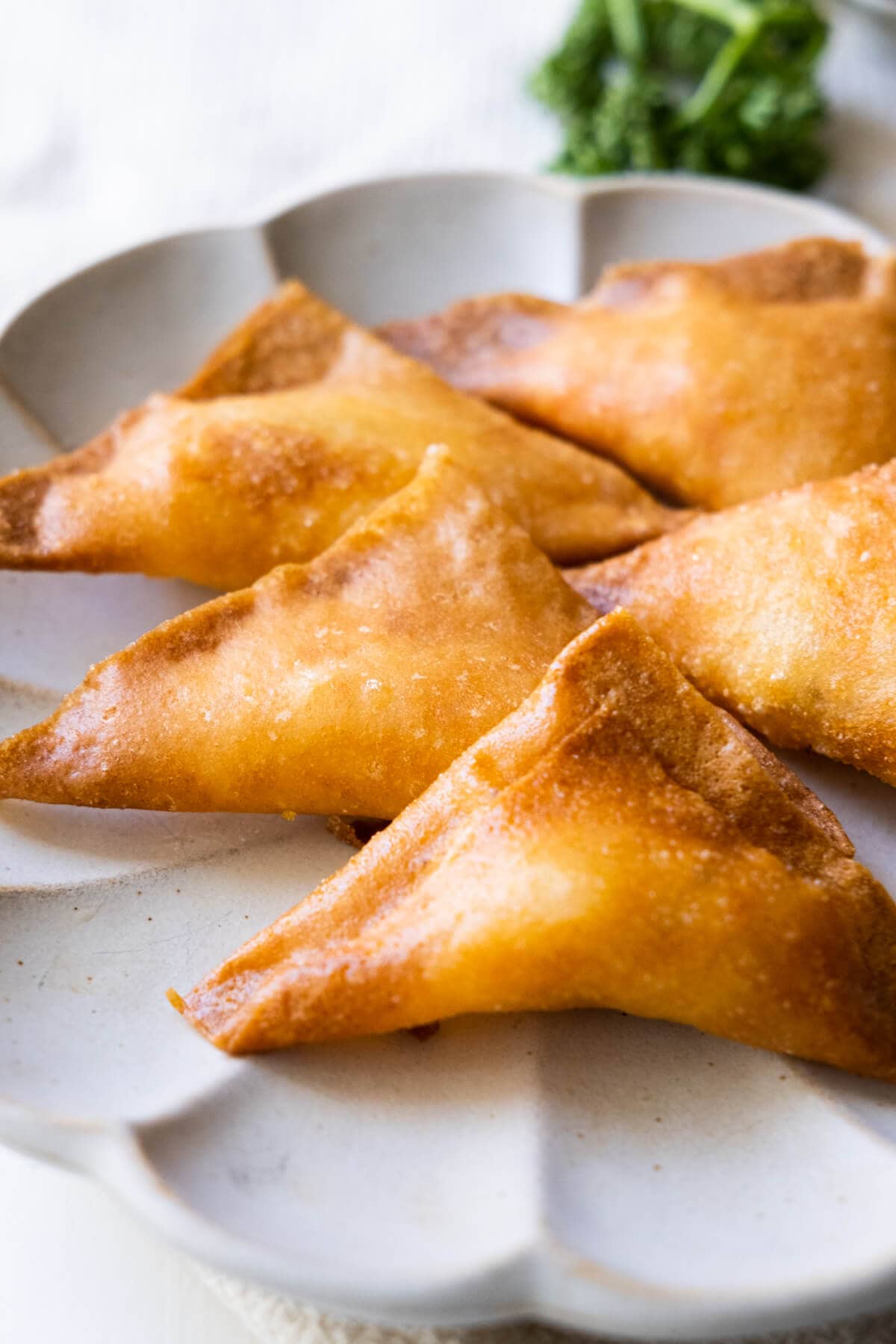 Crispy samosas on a plate, ready to serve. 