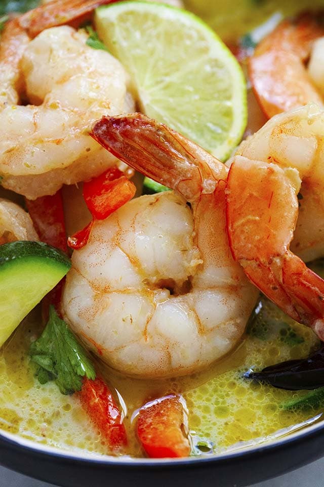 Close up shot of Thai shrimp curry in green curry sauce with vegetables.