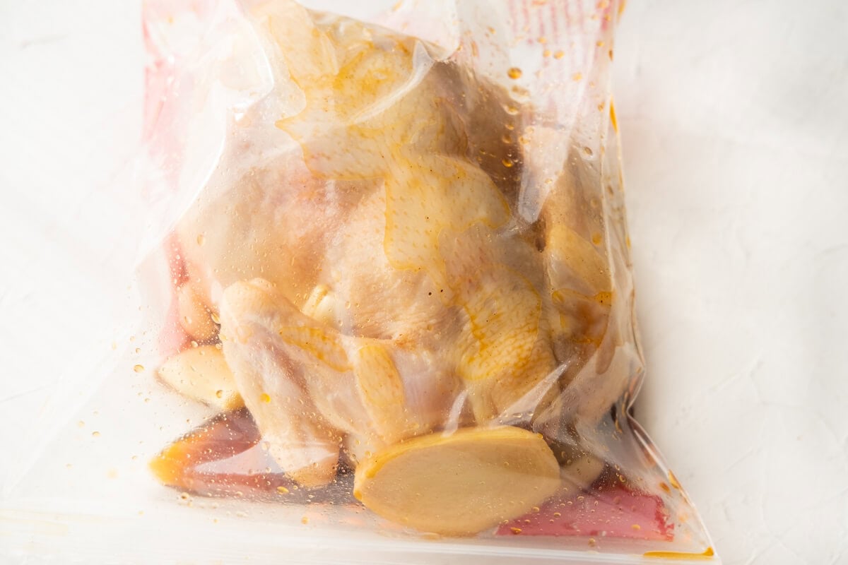 Marinating the whole chicken with the marinade in a ziploc bag. 