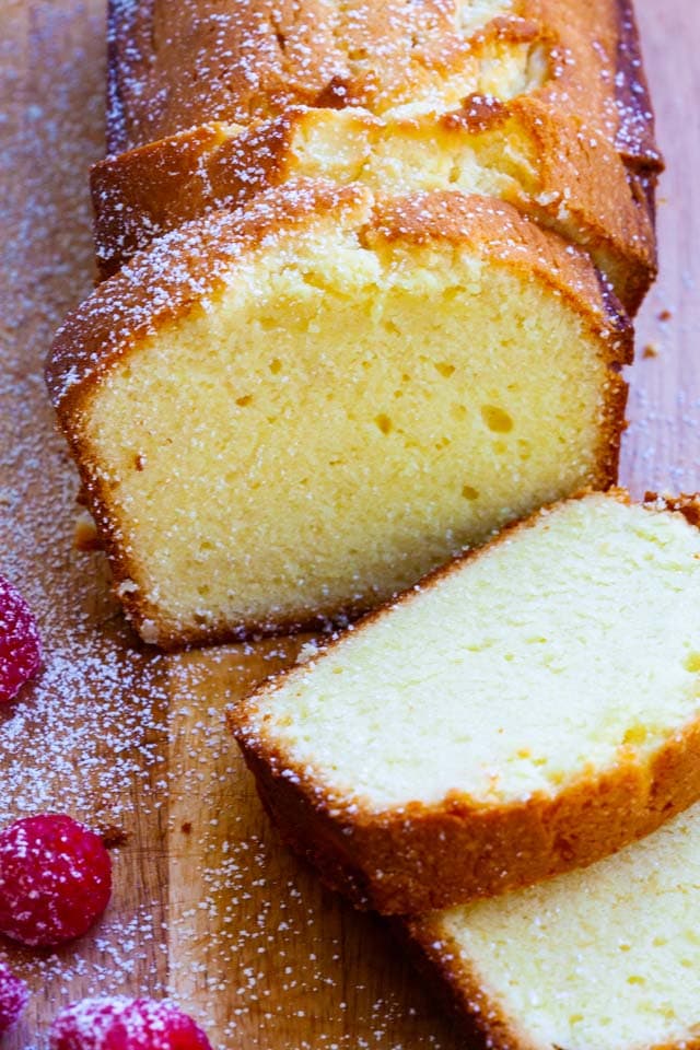 Cream cheese pound cake loaf, sliced into pieces, ready to serve.