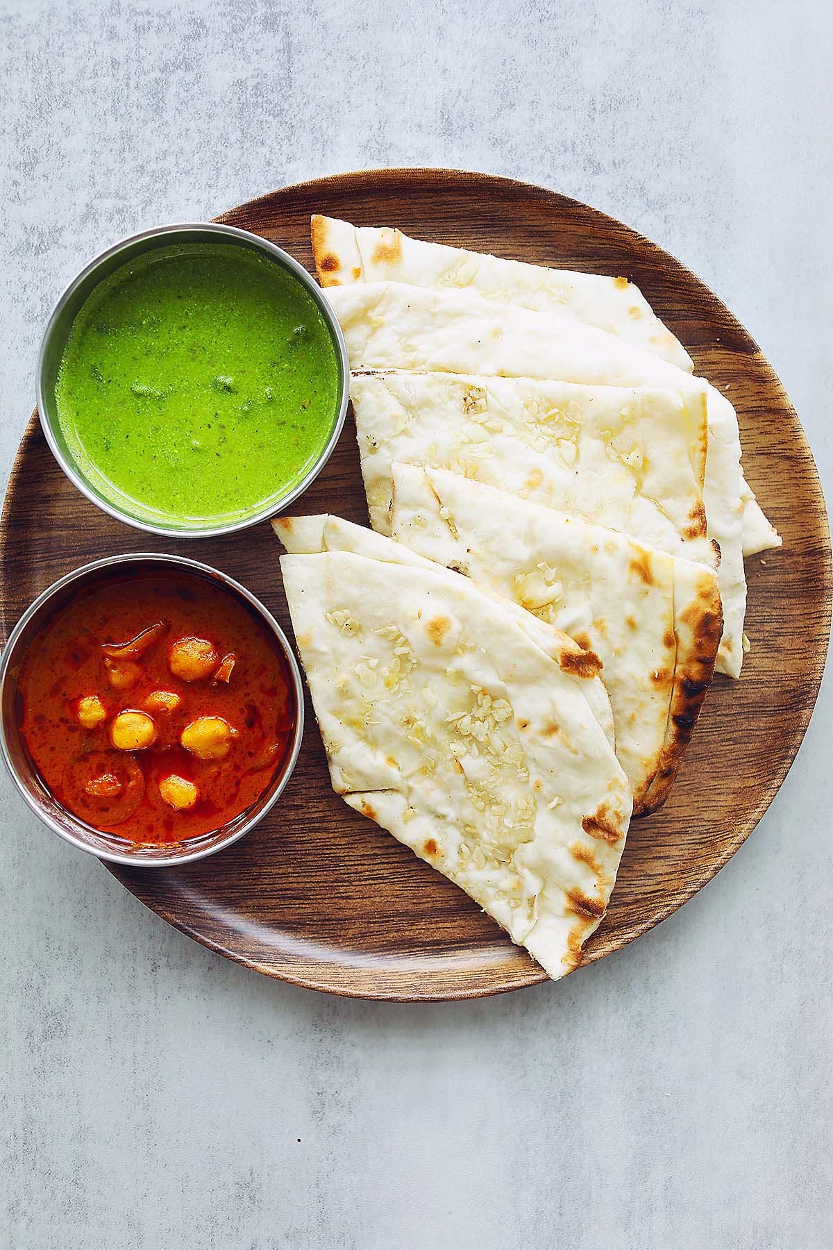 Garlic naan served with chana masala and pudina chutney.