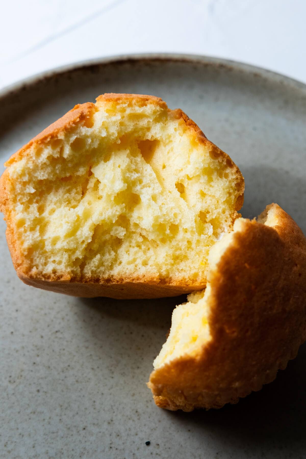 Inside of a soft, golden yellow Chinese egg cake. 