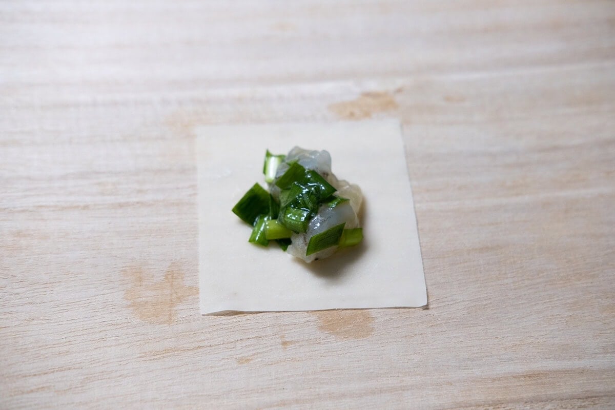 Shrimp and chive filling on a wonton skin.  