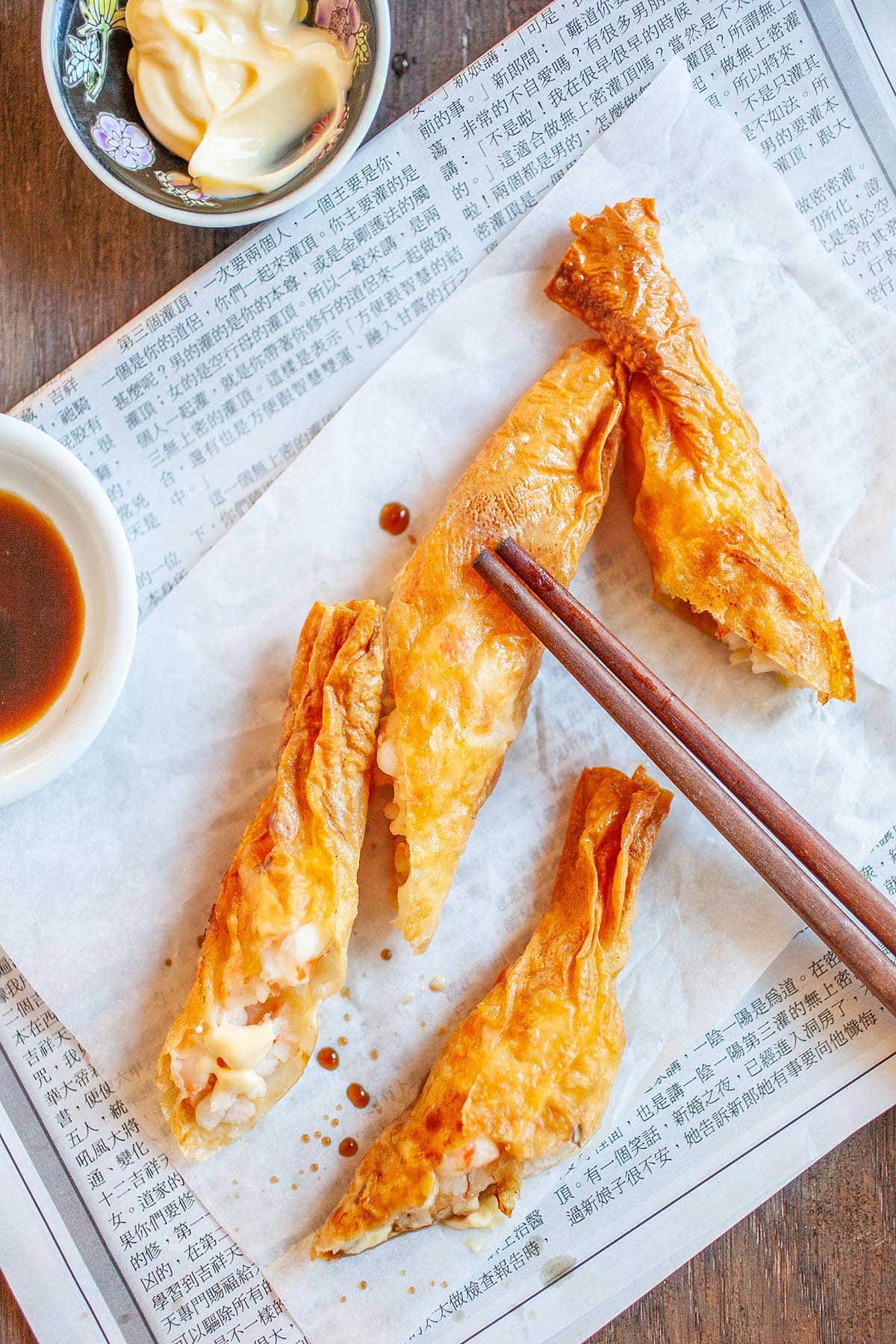 Easy and quick Hong Kong crispy shrimp rolls appetizer with a pair of chopsticks.