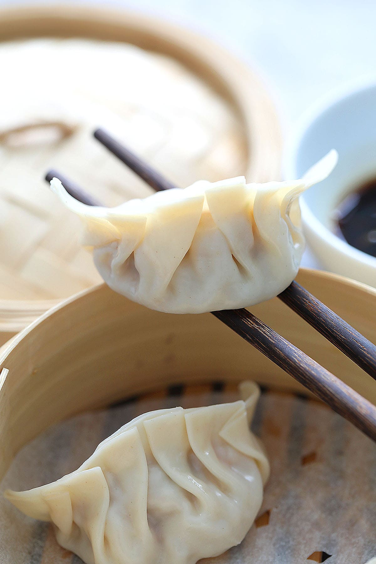 Pork steamed dumplings in a bamboo steamer. 