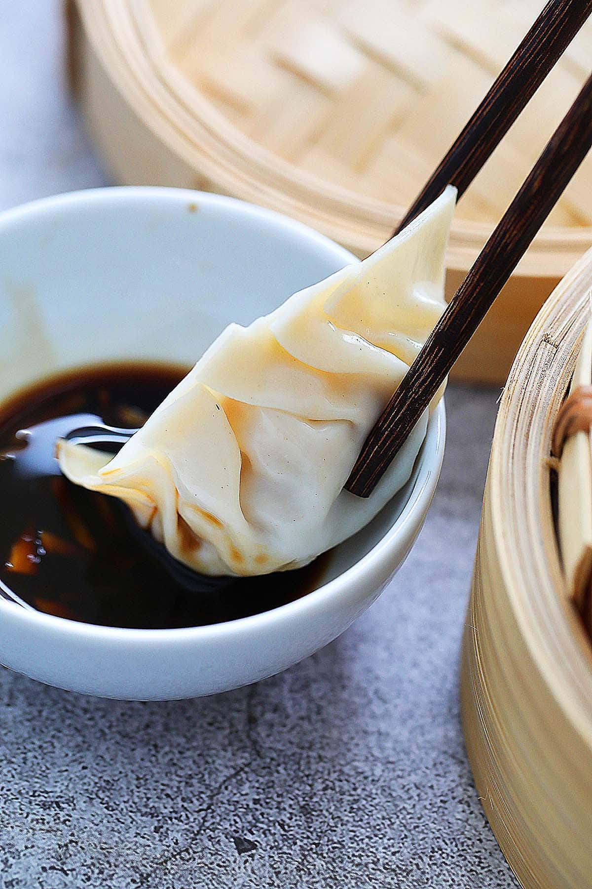 Homemade steamed dumpling served with vinegar dipping sauce. 