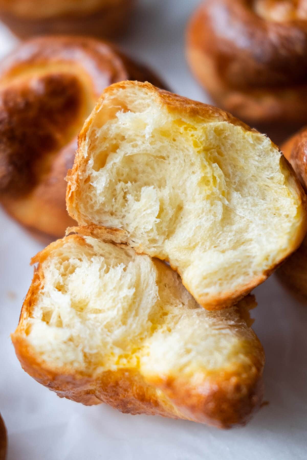 Soft and fluffy homemade French Brioche rolls, break in half.