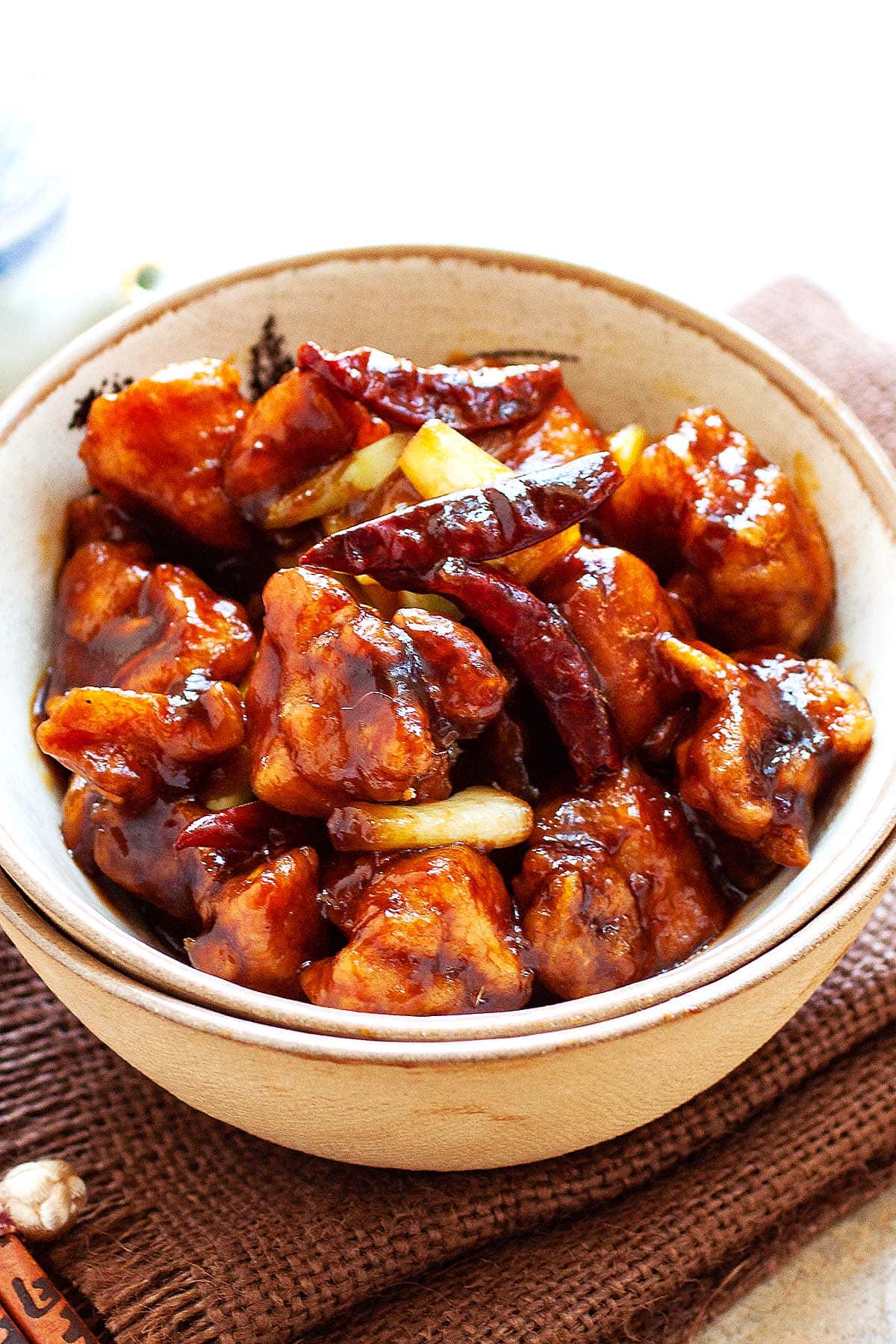 General Tso Chicken with delicious General Tso Sauce and red chilis in a bowl.