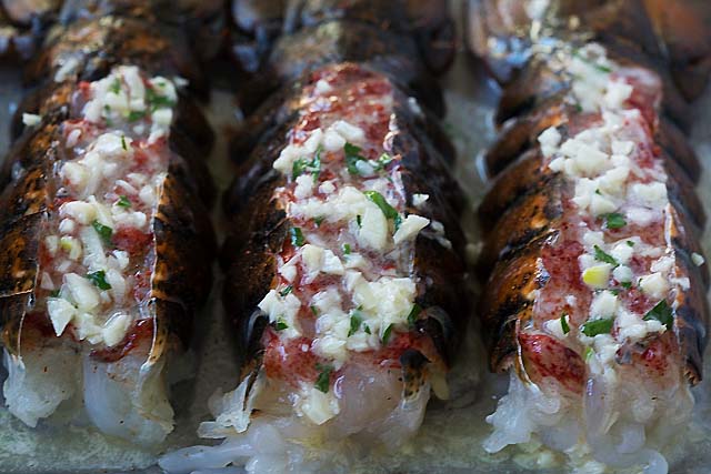 How to cook lobster tail? Broil the tail in the oven with garlic butter and herb for 5-8 minutes.