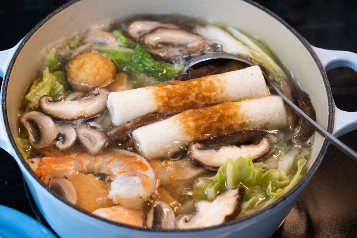 Chinese steam boat with chicken, seafood, mushroom and vegetables. 