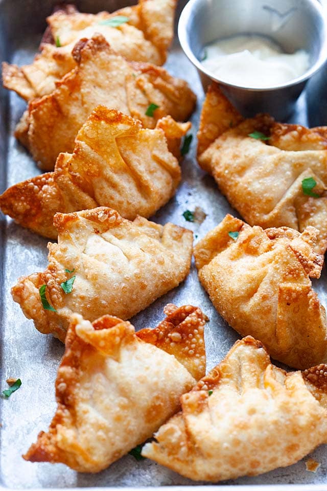 Shrimp wontons deep-fried to crispy goodness, on a serving tray.